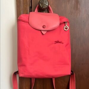 Longchamp Red/Pink Backpack with Streamlined Design and Flap Closure